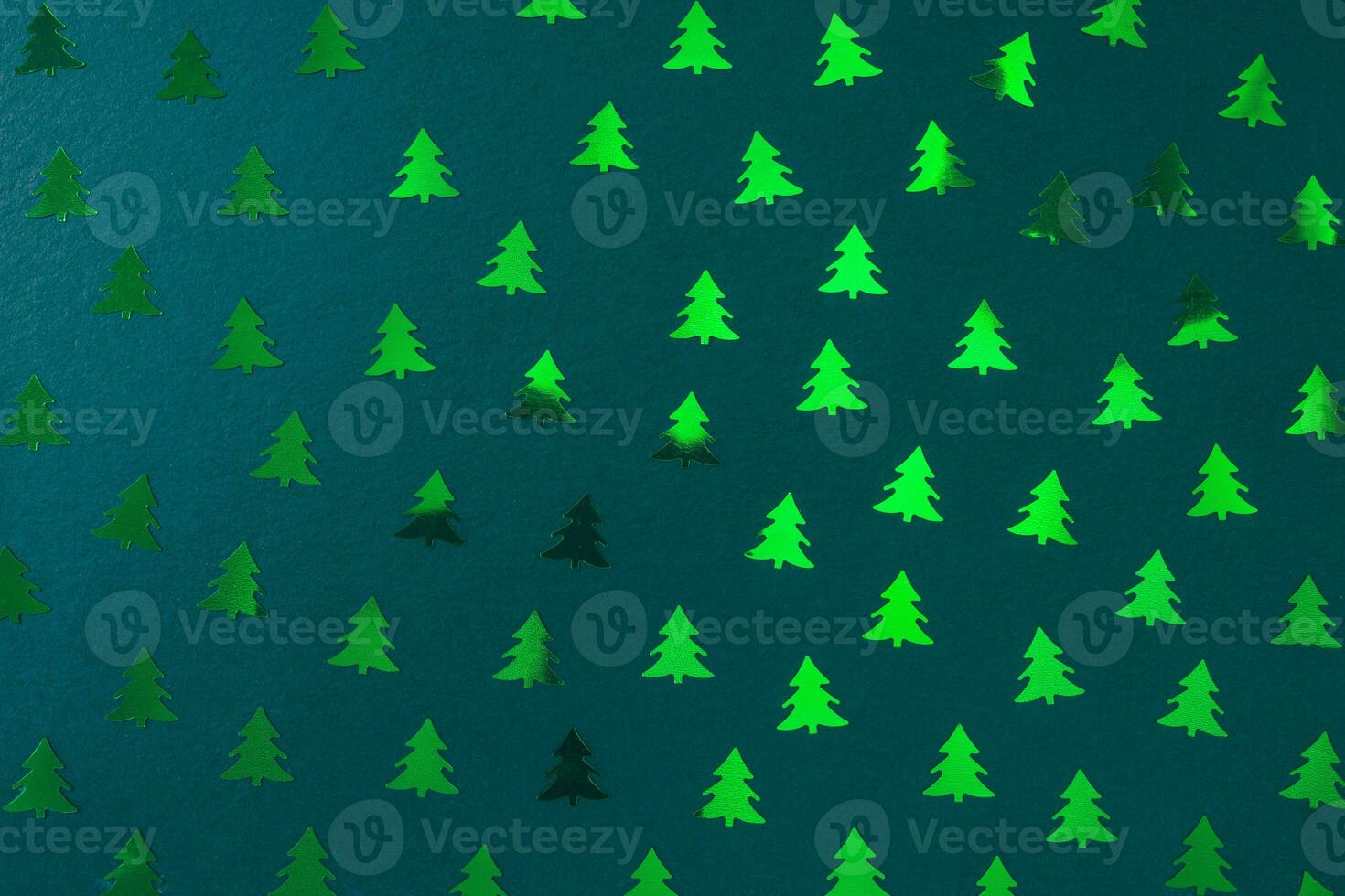Christmas tree decoration pattern on green. Christmas abstract background photo