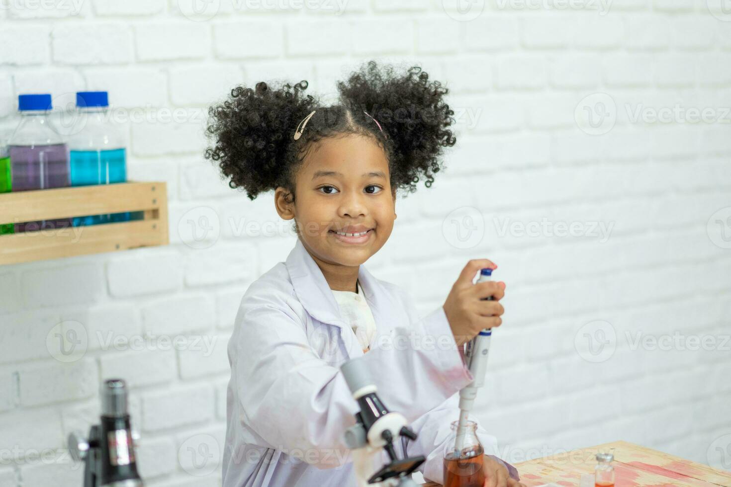 Portrait african of cute little scientist girl student learning Concept of good practice and education of science for children support in lab. photo