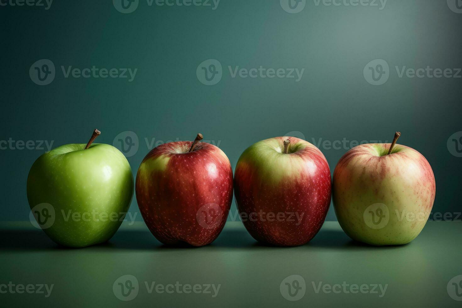 Four Apples of Different Colors Lined Up photo