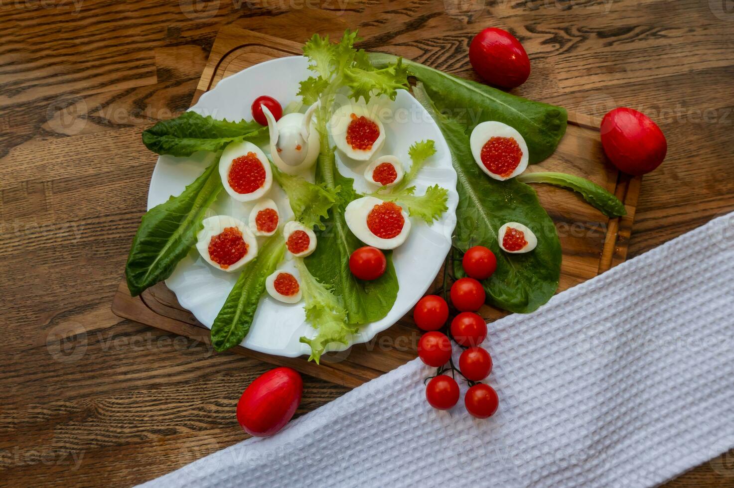 background of red caviar on dsrk wooden surface. tartlets with red caviar photo