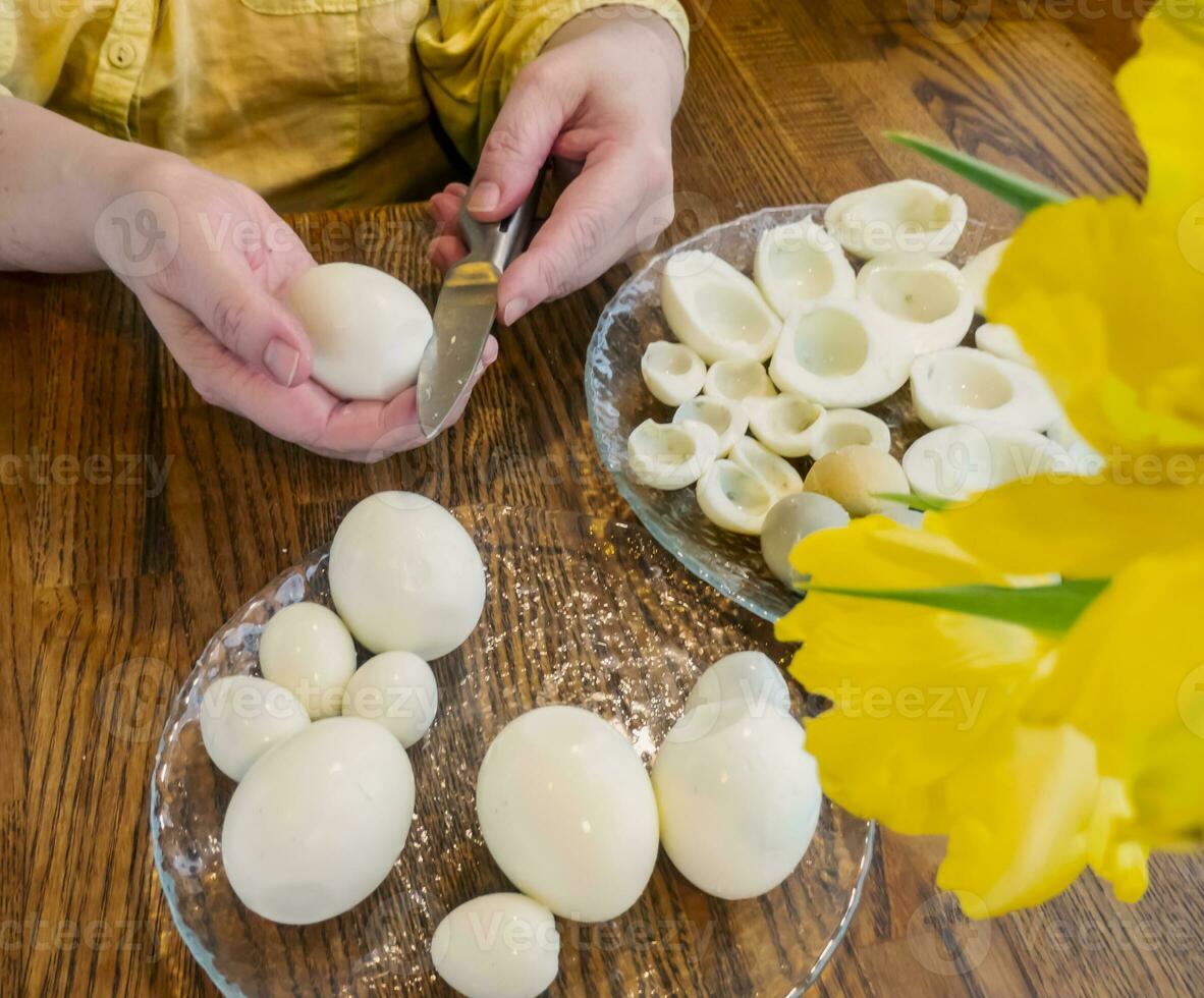 Step by step. egg cut in half, for making stuffed eggs photo