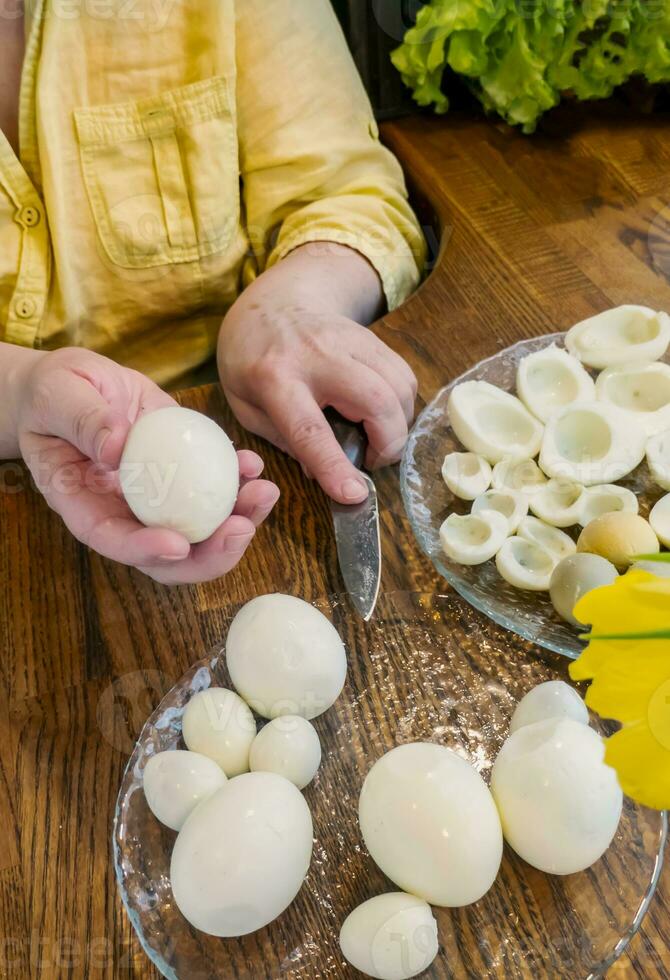 Step by step. egg cut in half, for making stuffed eggs photo