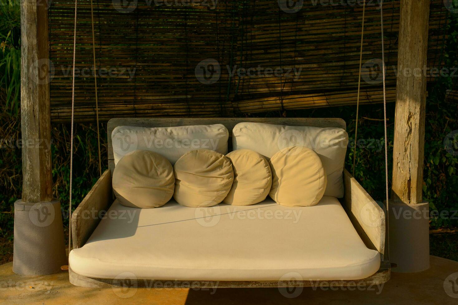 Cozy style. Beige cushions decorate the house on the sofa at afternoon. photo