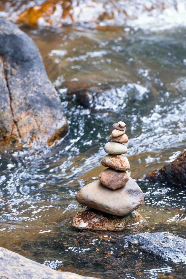 Stacked stones in a waterfall photo