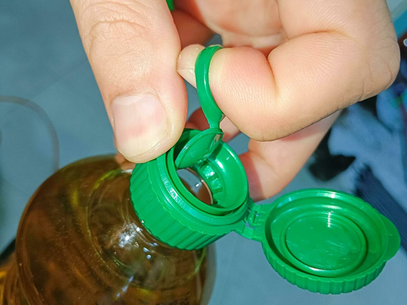 Open Cap Of Vegetable Oil Bottle Before Cooking photo