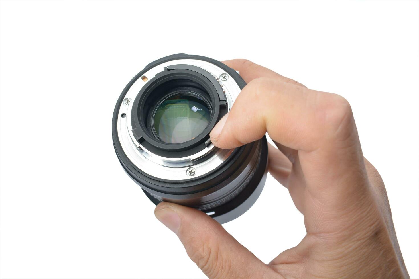 camera lens in male hand isolate white background photo
