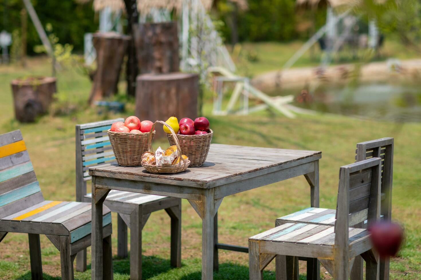 bread and fruit on the table in the garden.  image selective focus photo