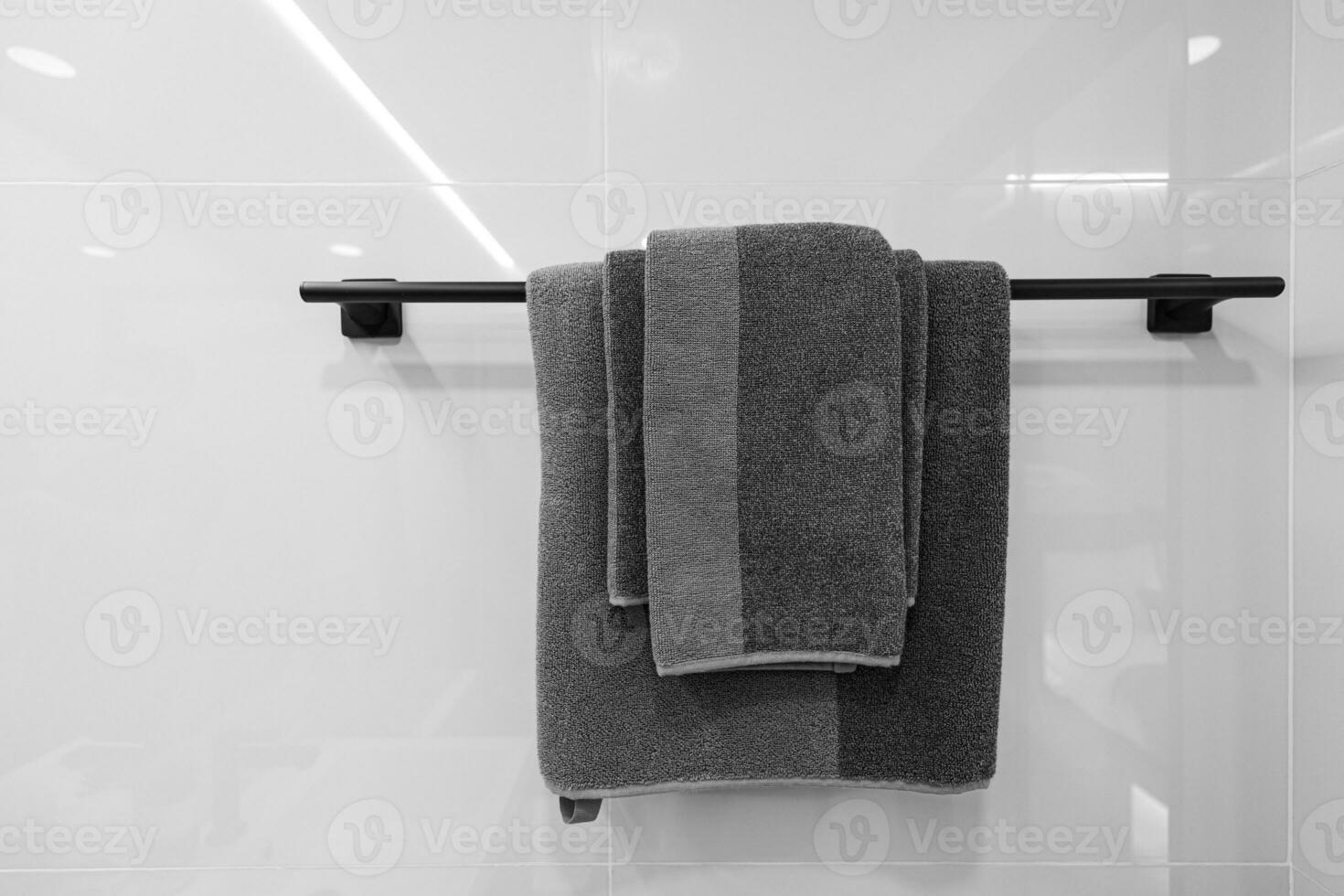 Closeup towel hanging on clothesline in the bathroom with space for texts photo