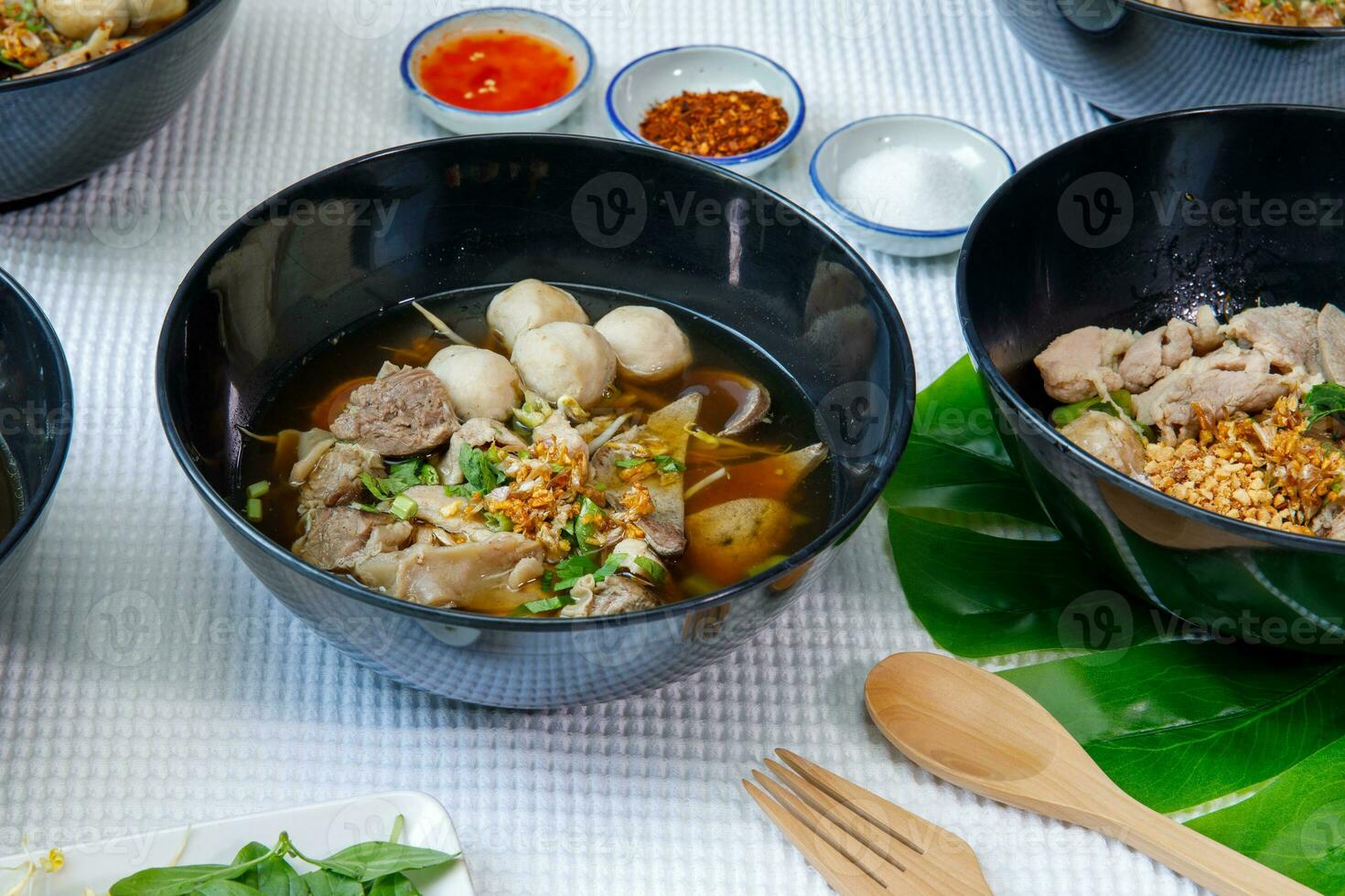 Braised pork and pork ball with noodles soup in bowl, Chinese-Thai food. photo