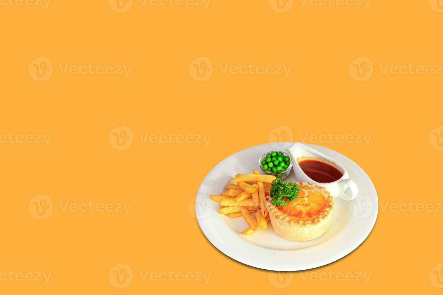 Steak and kidney pie with puff-pastry top and French fries photo