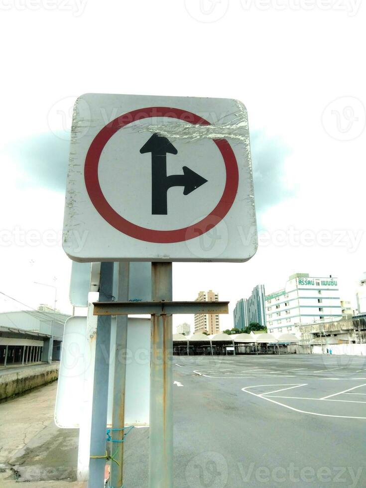 Signs pointing straight to the right turn photo