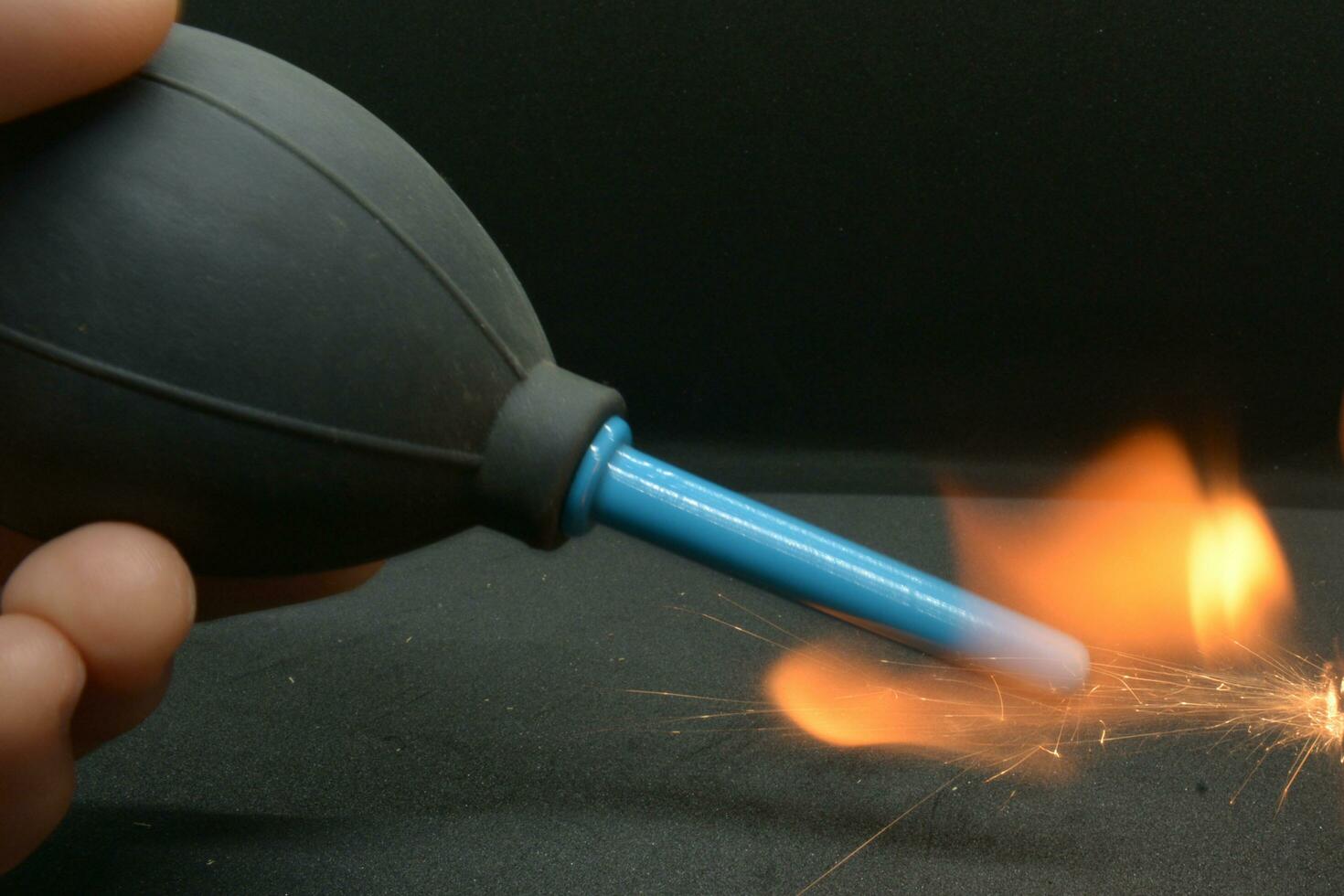 camera blower on fire, black background photo