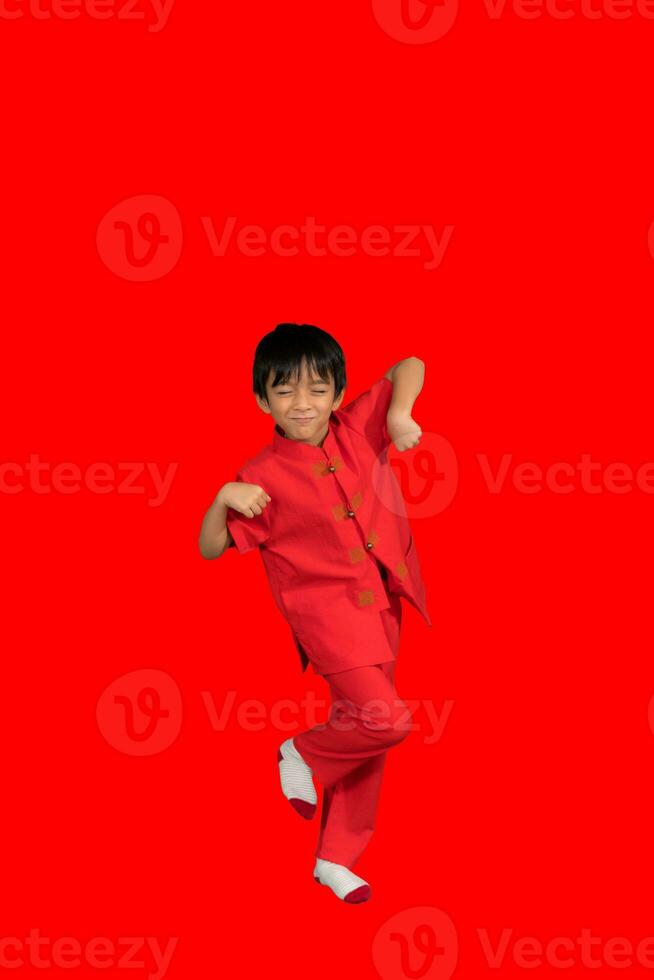 little boy fashion Smiling child in red chinese dress, style and fashion ideas for children. photo