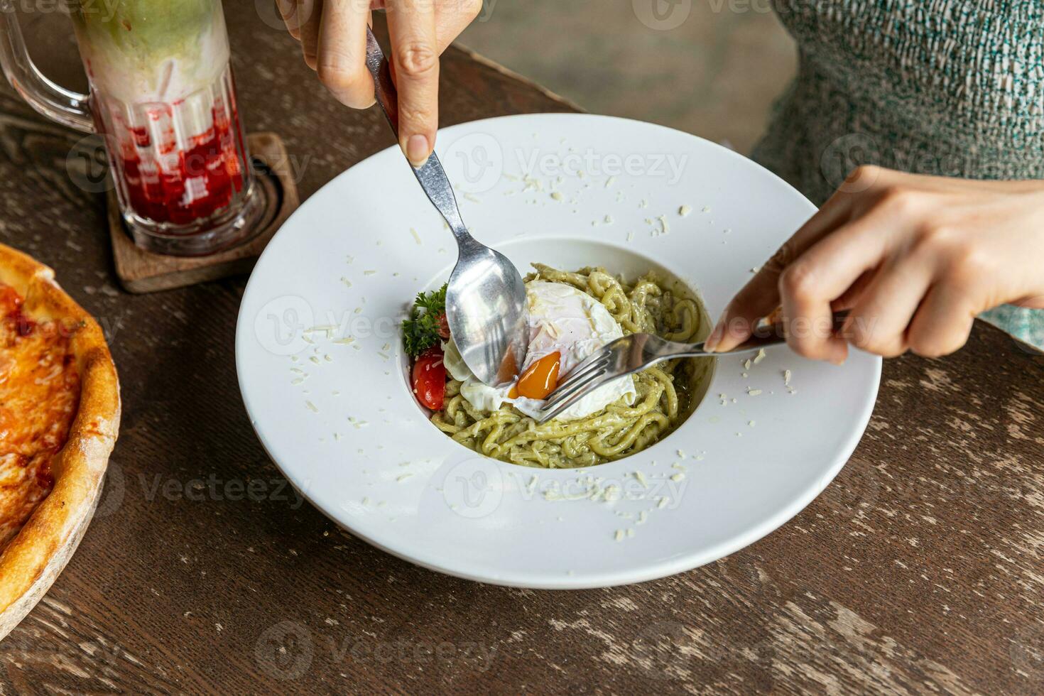 Pasta spaghetti with pesto sauce in bowl. Light grey background.Top view. Egg and bacon spaghetti carbonara. photo