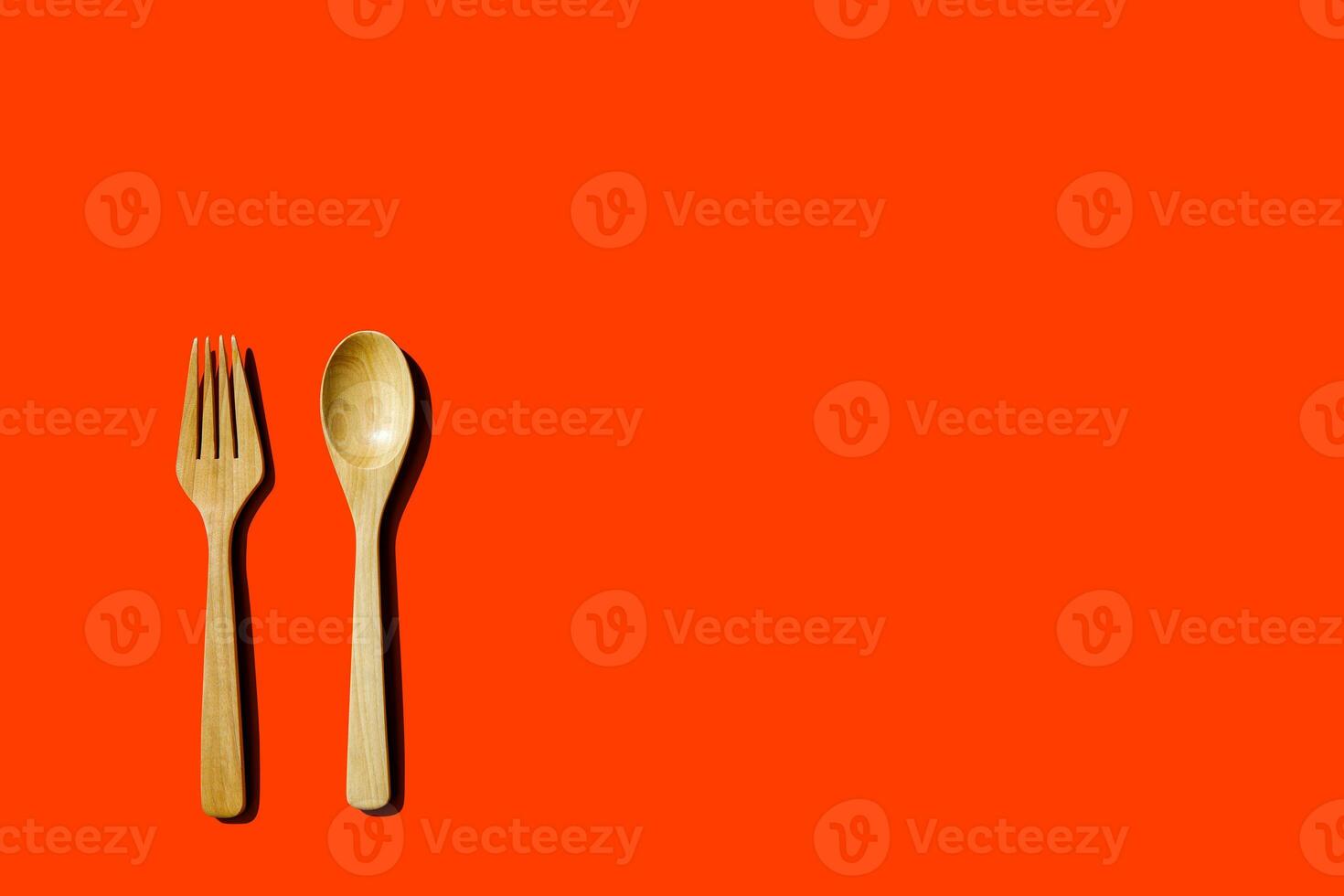 wooden spoon and fork, light and shadow Top view with space for your recipes. photo