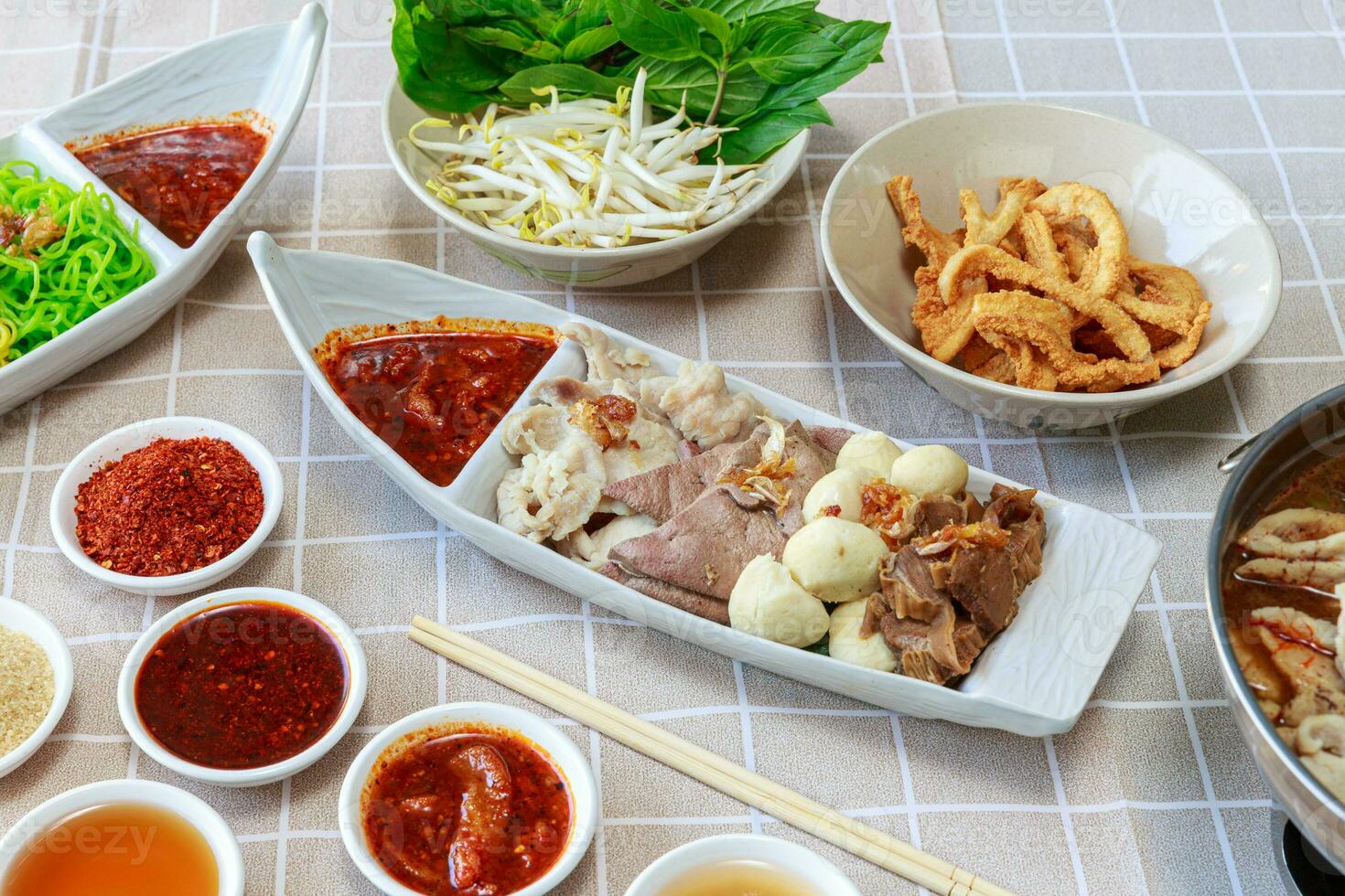 Soft Boiled Mixed Meat with Spicy Dip.  Thicken Boat Noodles Soup photo