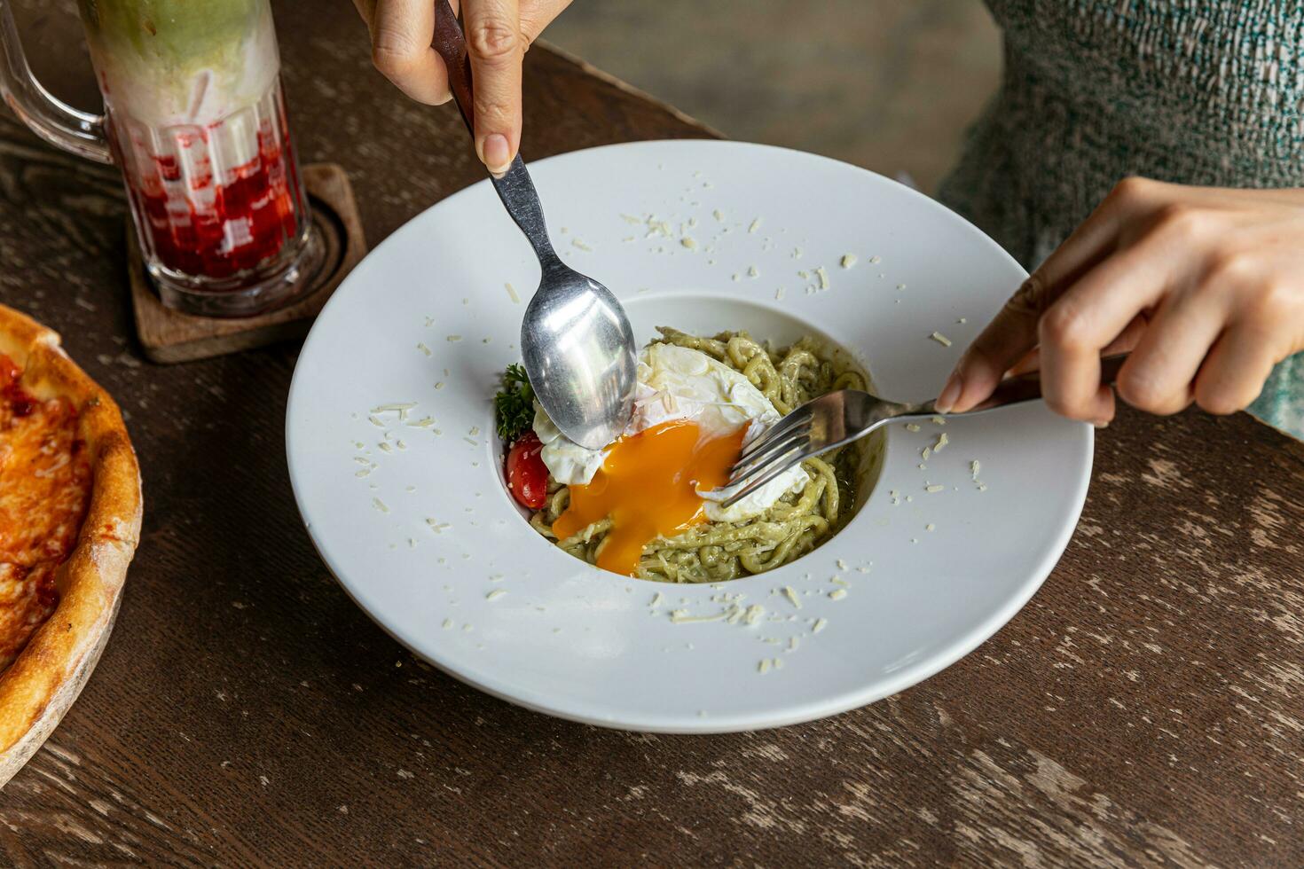 Pasta spaghetti with pesto sauce in bowl. Light grey background.Top view. Egg and bacon spaghetti carbonara. photo