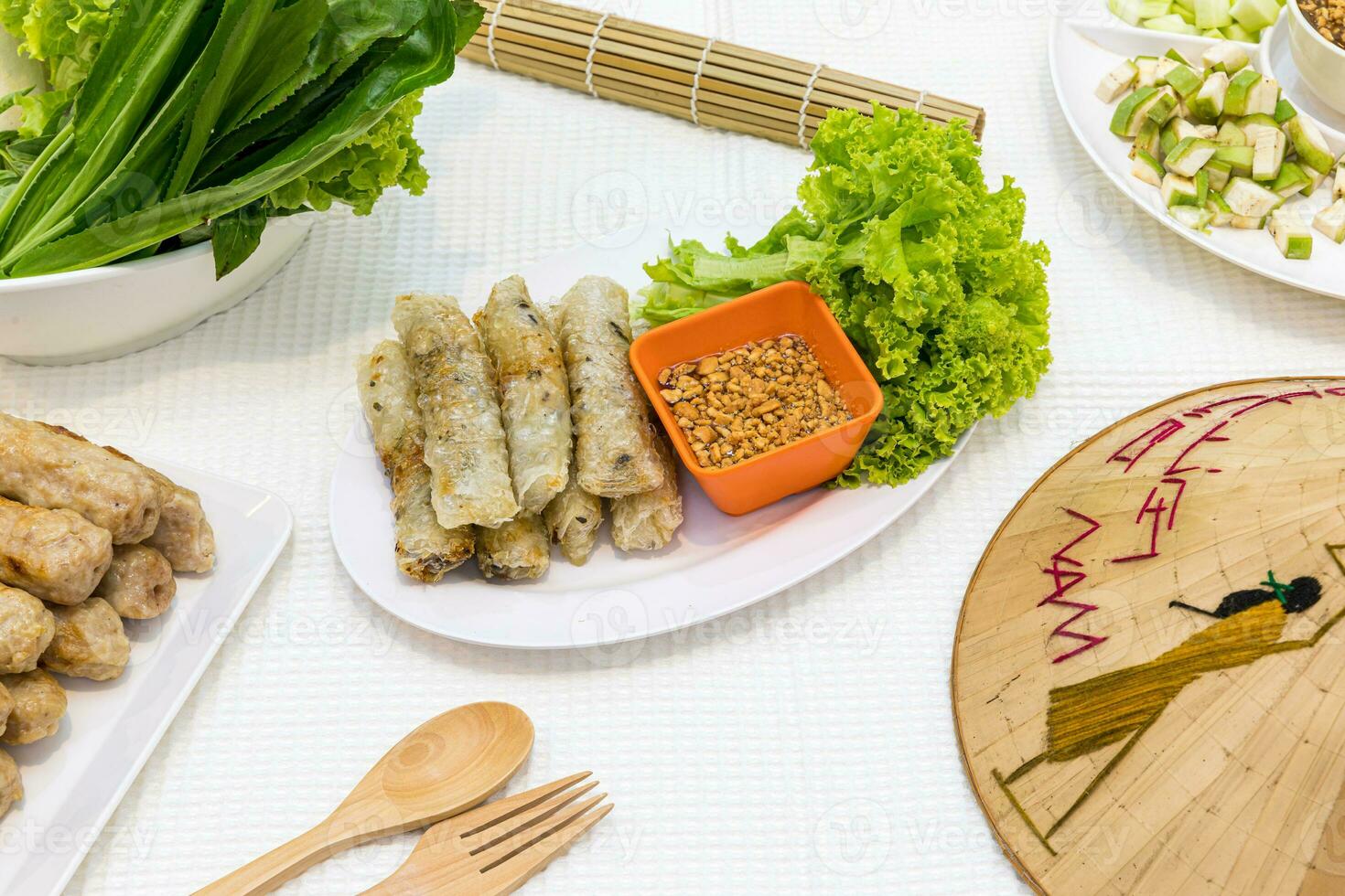 Fried Vietnamese Spring Rolls surrounded by  food Vietnamese photo