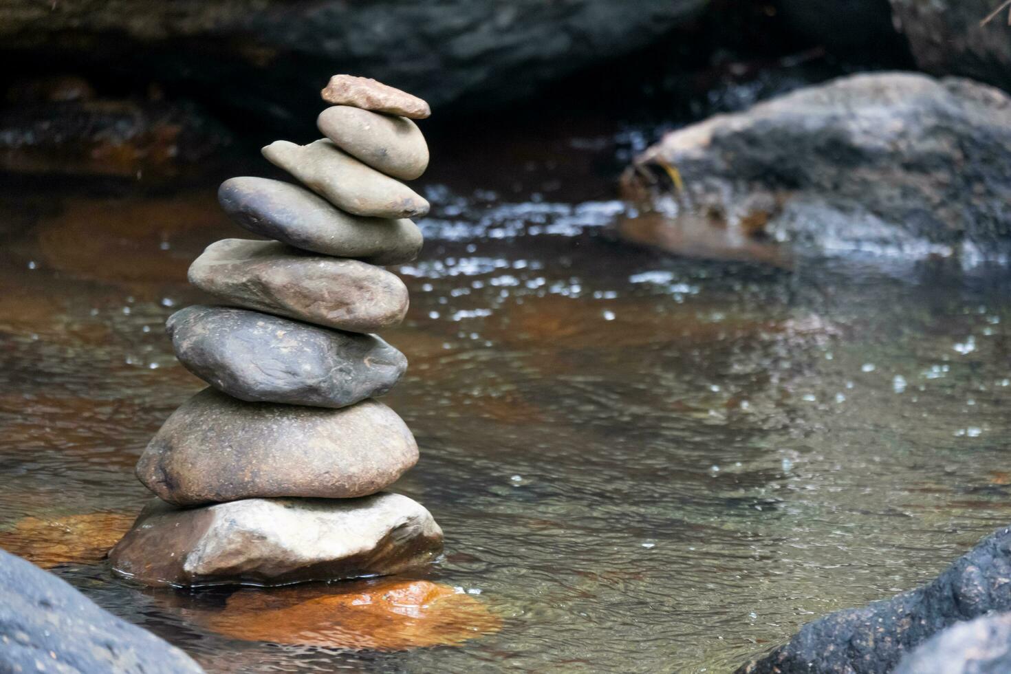 Stacked stones in a waterfall photo