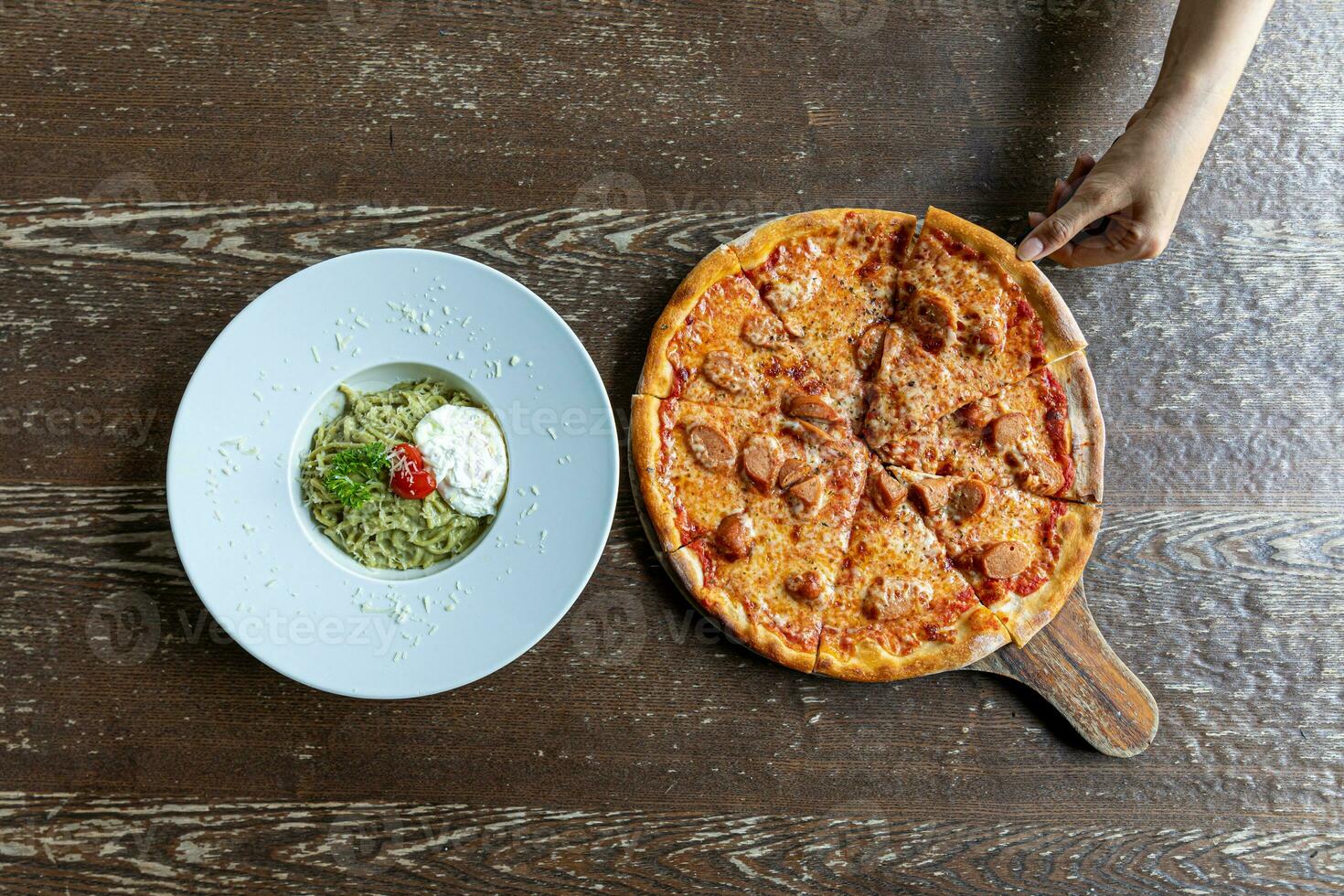 spaghetti carbonara with onset egg and  pizza photo