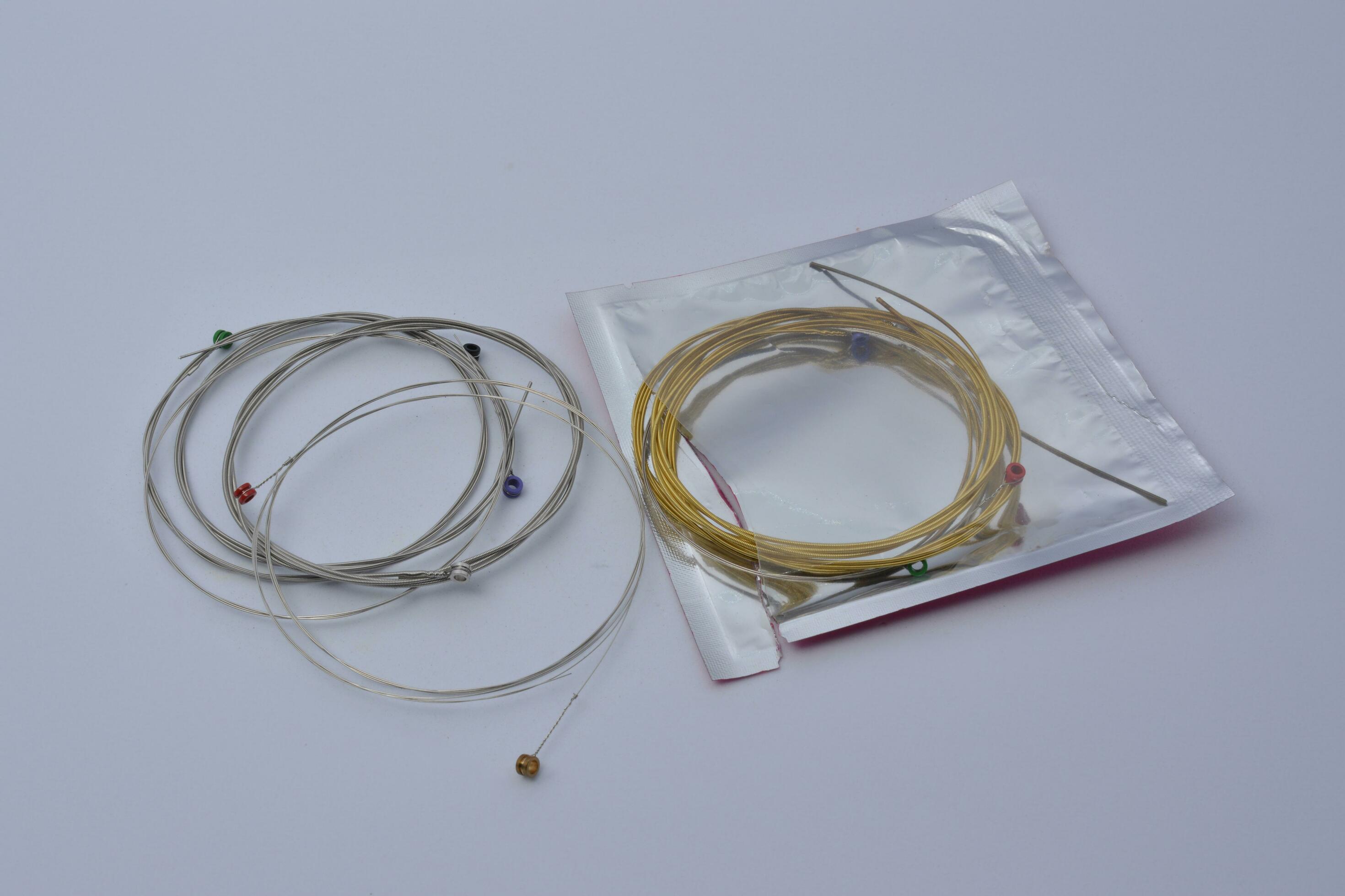 Multicolored guitar strings white background 26550131 Stock Photo at