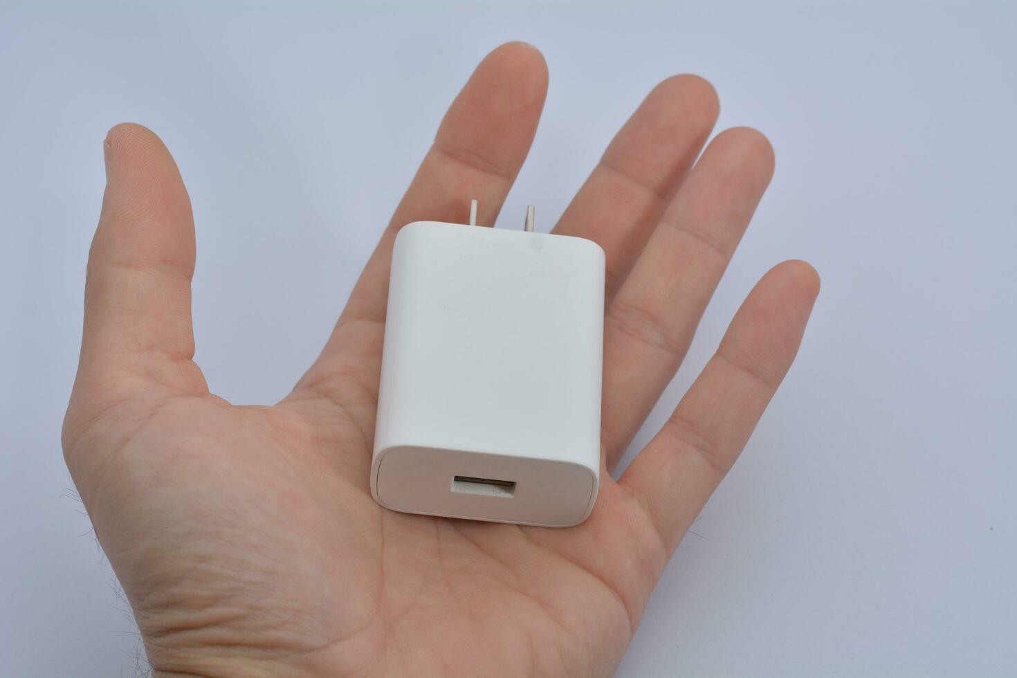 white mobile phone charger on a white background photo