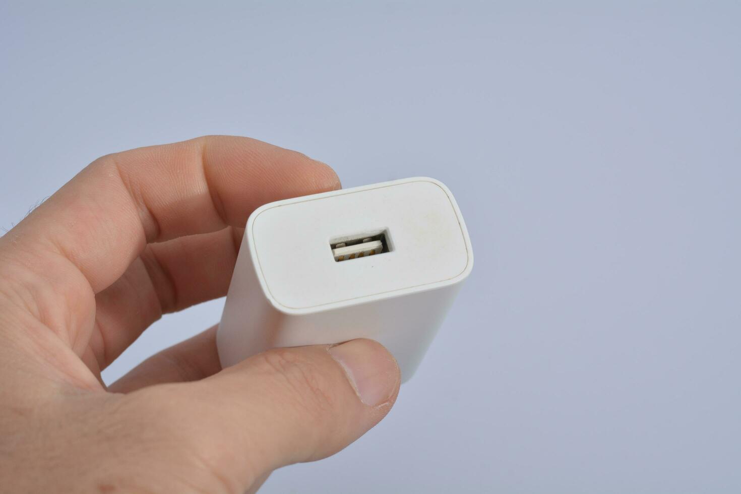 white mobile phone charger on a white background photo