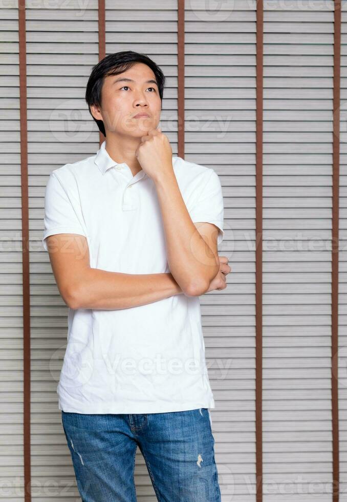 Portrait of a man Asian standing in black t-shirt and shorts. Isolated  on background with copy space and clipping path photo