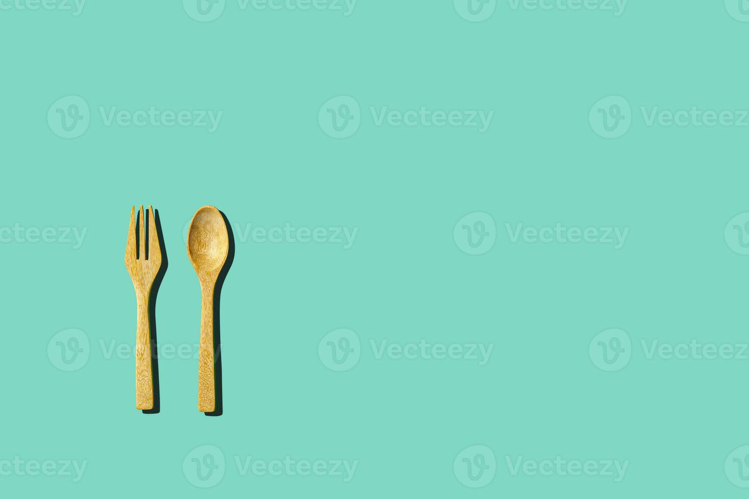 wooden spoon and fork, light and shadow Top view with space for your recipes. photo