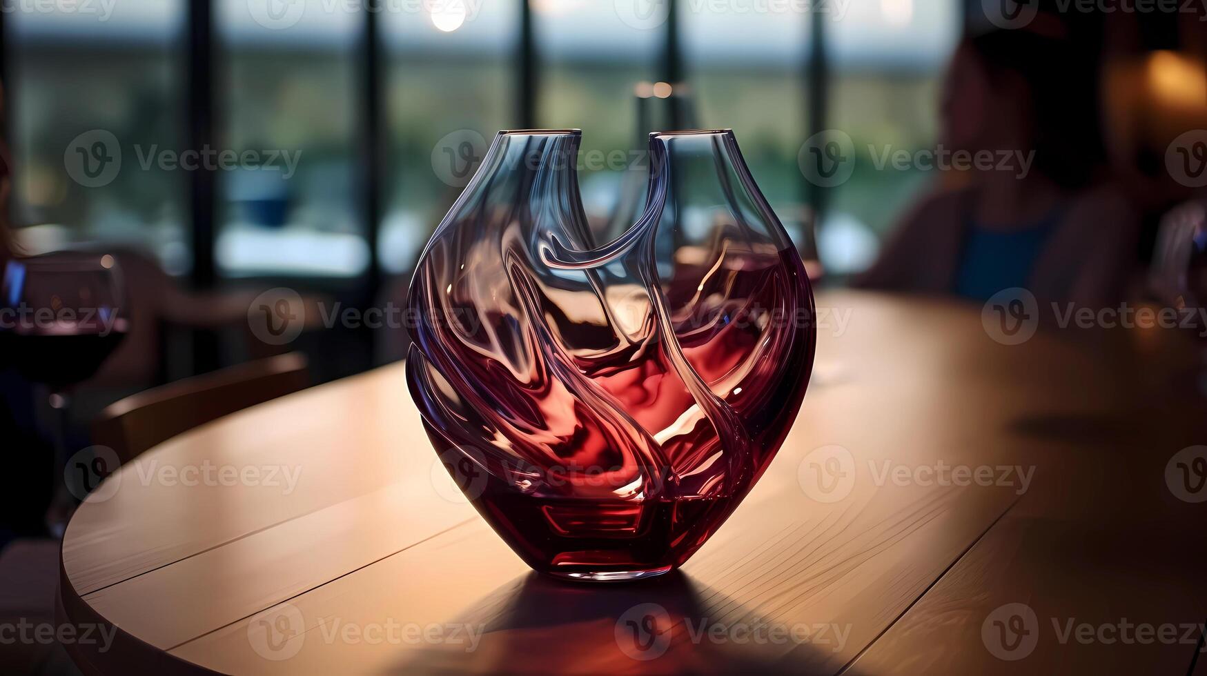 Beautiful glass wine decanter on wooden table in restaurant. It aerates red wine by bringing it into contact with air. . Horizontal photo