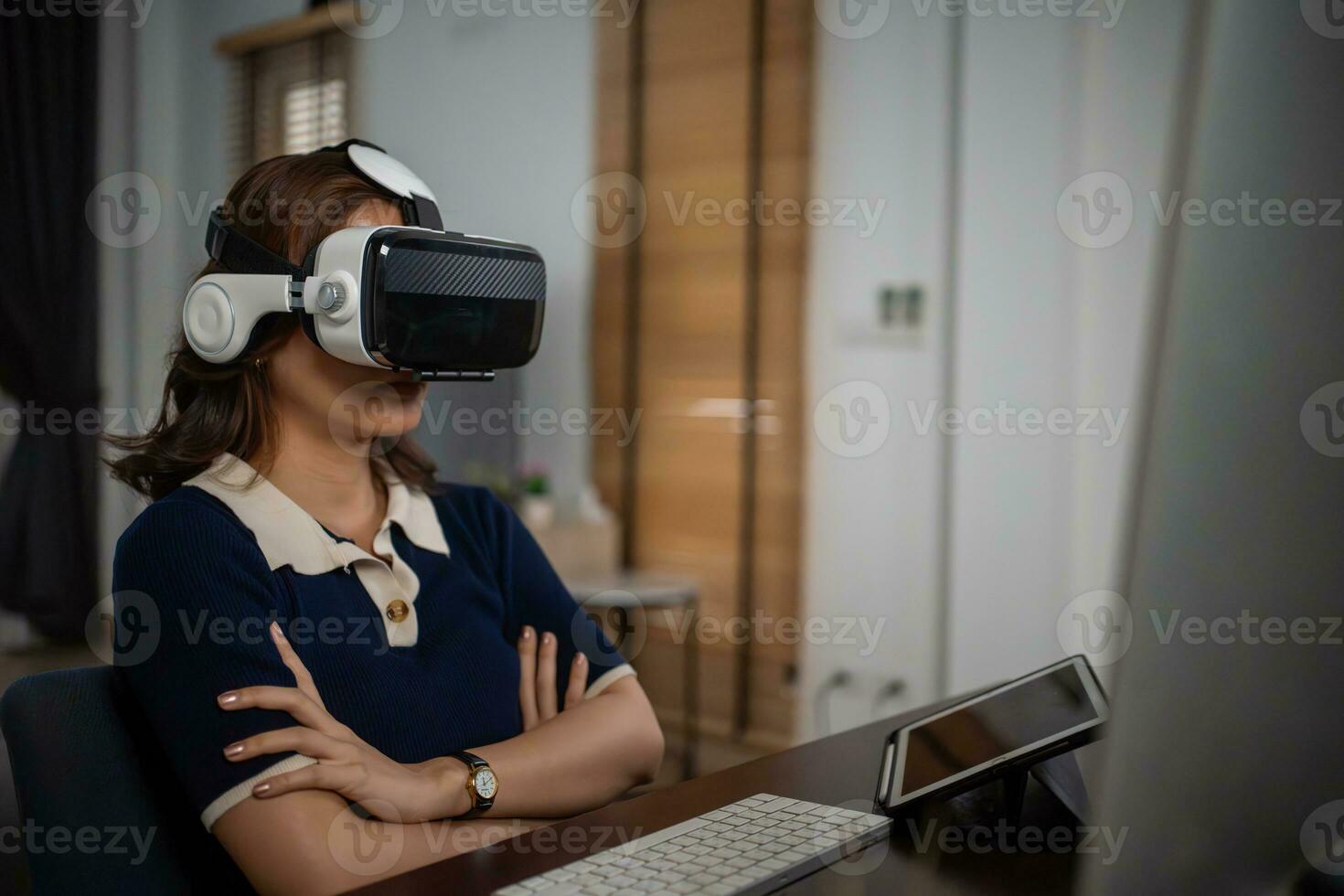Futuristic women Engineer Wearing Virtual Reality Glasses working with a futuristic hologram to analysis and create alternative energy solutions with wind turbines photo