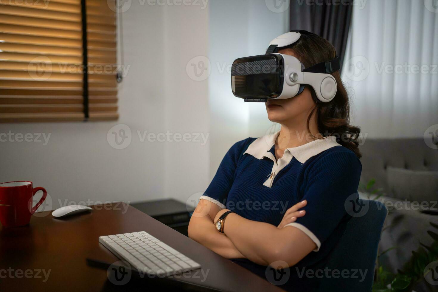 Futuristic women Engineer Wearing Virtual Reality Glasses working with a futuristic hologram to analysis and create alternative energy solutions with wind turbines photo
