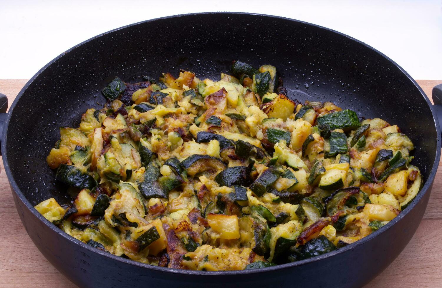Mix of vegetables in a pan. Fricando of vegetables. photo