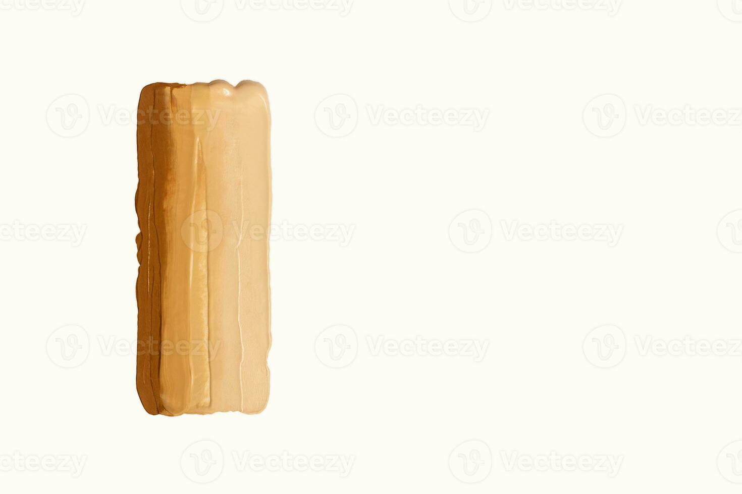 Texture of foundation in different shades. Swatch of cosmetic product in shape of rectangle on white background. photo