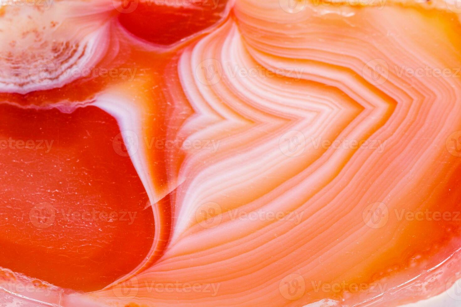 Macro mineral orange agate in crystals on white background photo