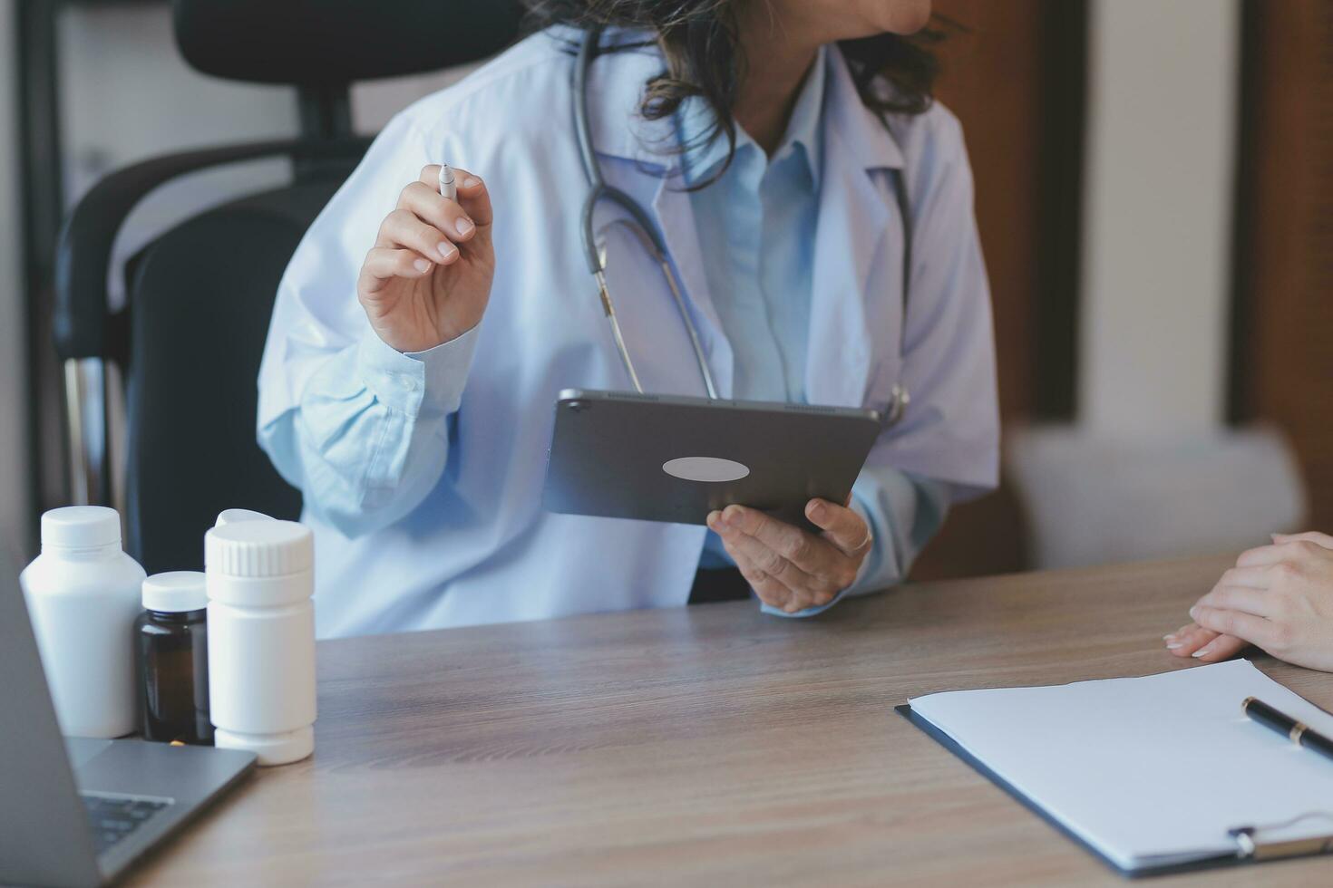 Mental health counselor. Young woman during therapy session talking with a psychologist in the office. photo