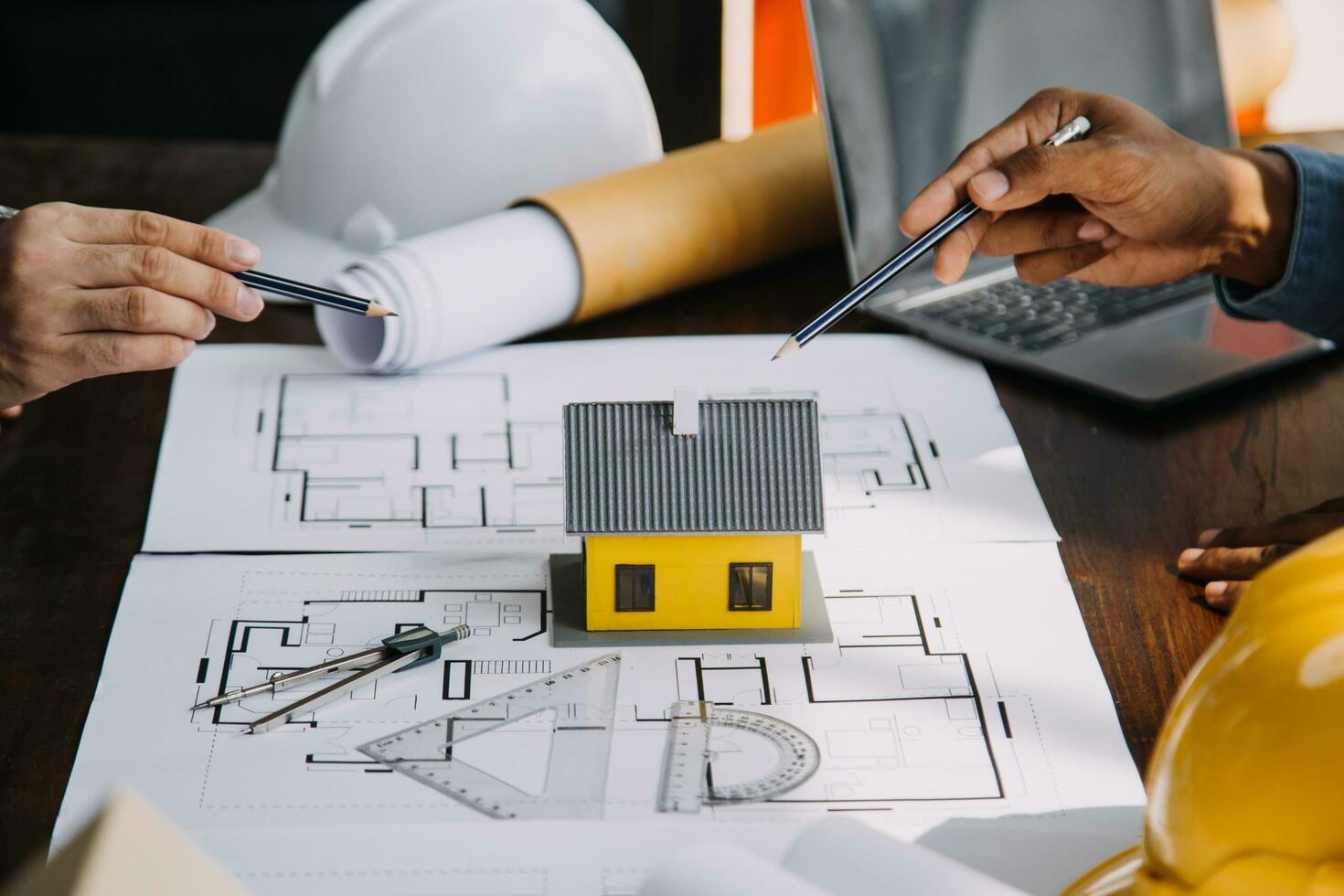 Engineer Teamwork Meeting, Drawing working on blueprint meeting for project working with partner on model building and engineering tools in working site, Construction and structure concept. photo