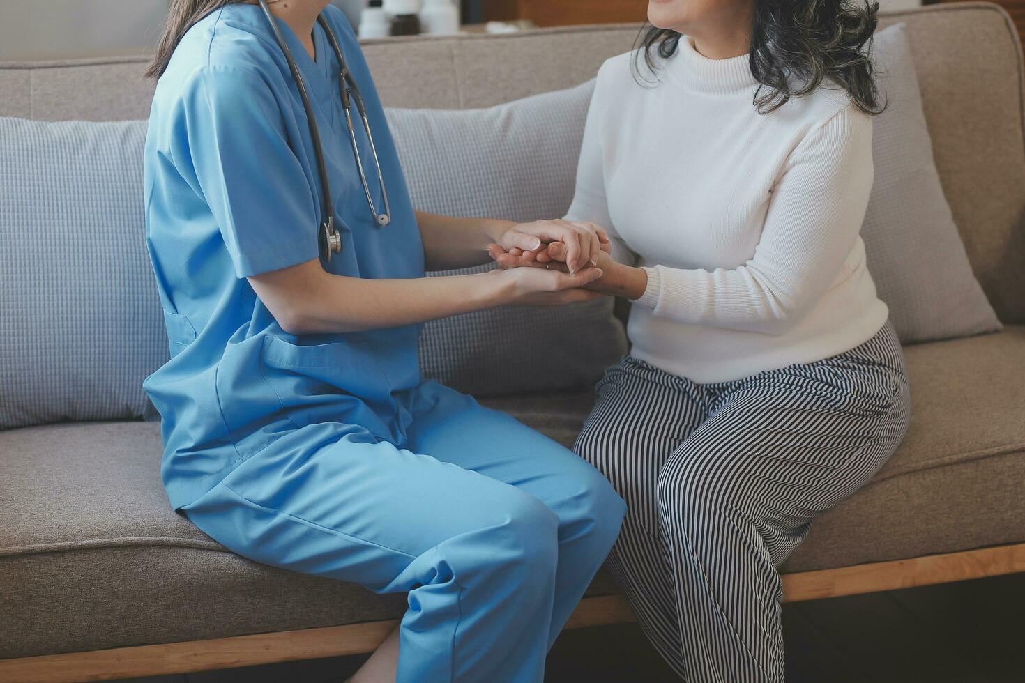 Asian elderly woman and caregiver. nursing care concept. photo