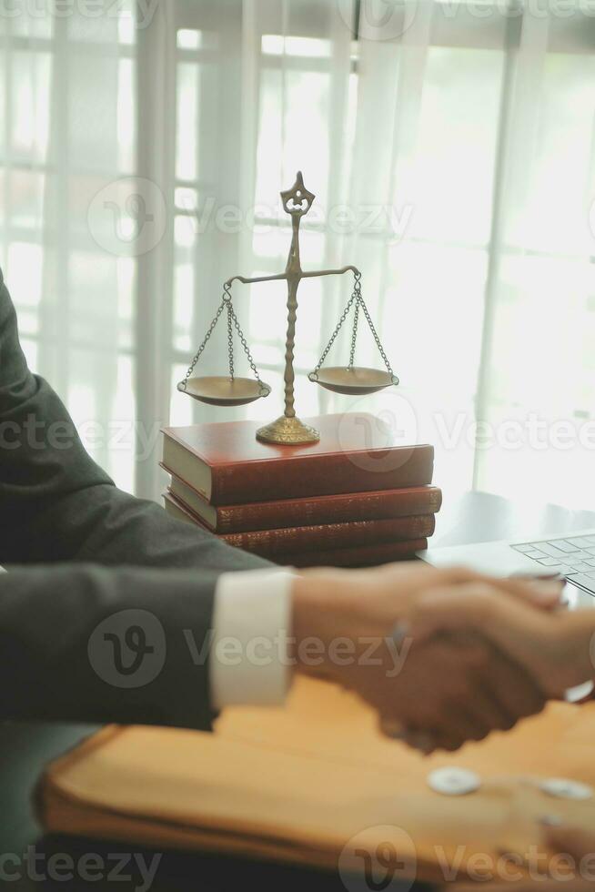 Judge gavel with Justice lawyers having team meeting at law firm background. Concepts of Law and Legal services. photo