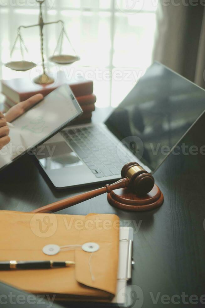 Judge gavel with Justice lawyers having team meeting at law firm background. Concepts of Law and Legal services. photo