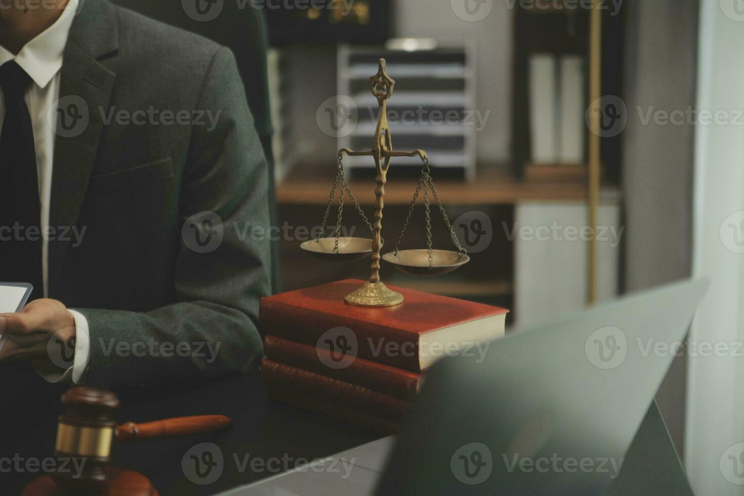 Judge gavel with Justice lawyers having team meeting at law firm background. Concepts of Law and Legal services. photo