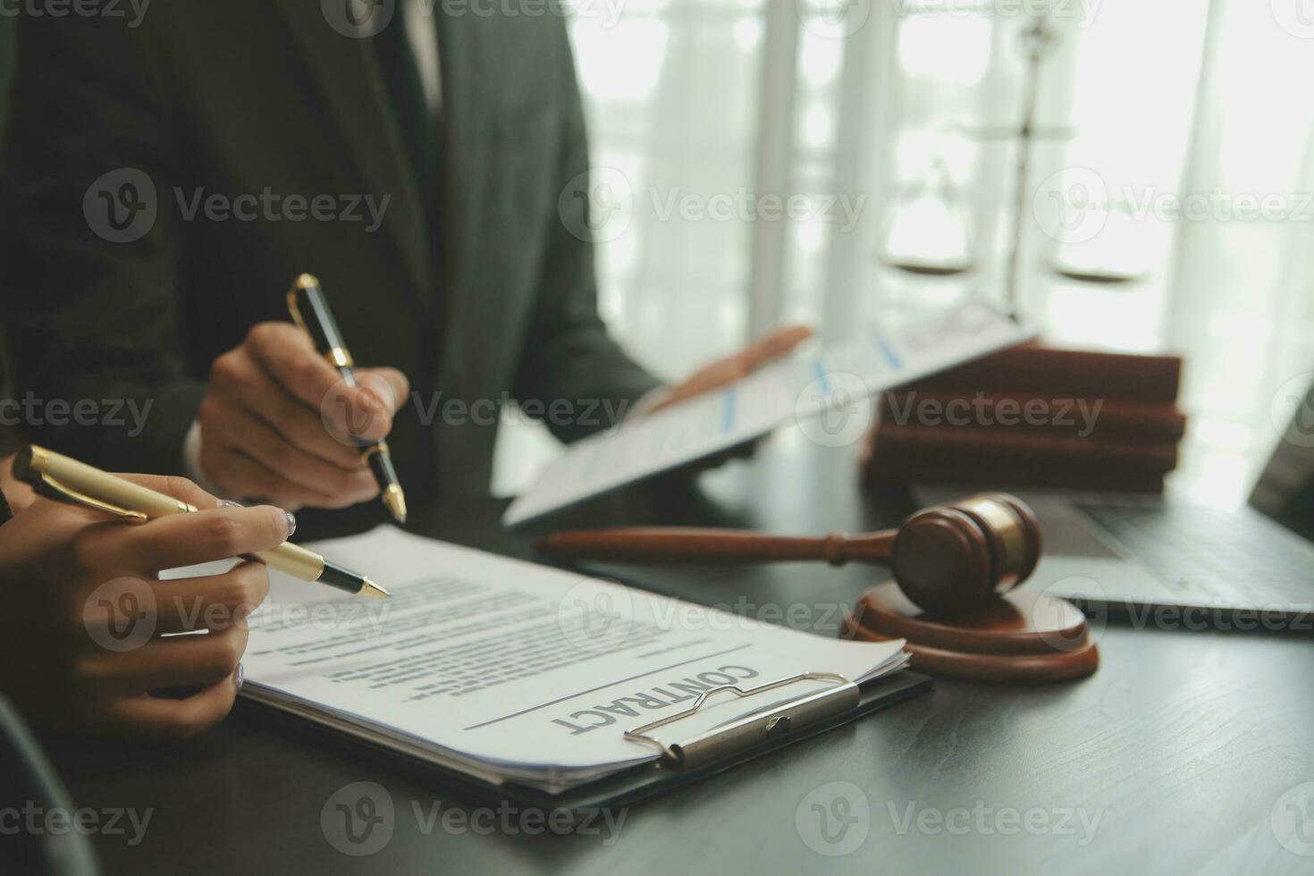 Judge gavel with Justice lawyers having team meeting at law firm background. Concepts of Law and Legal services. photo