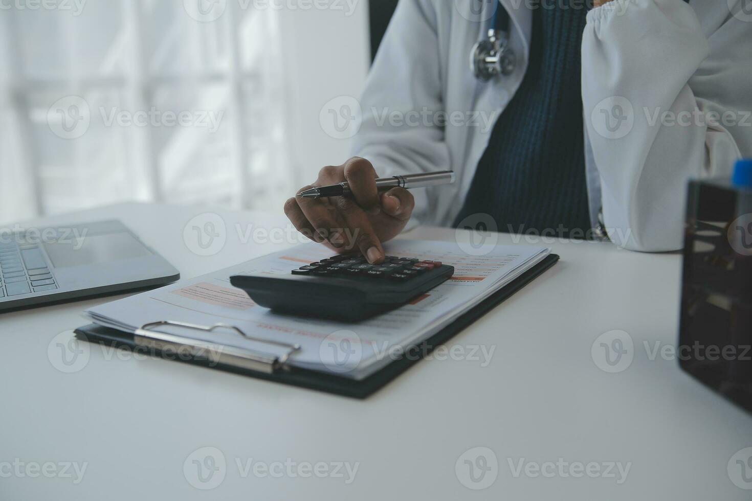 Professional lab. Amazing longhaired medical worker wearing uniform while using microscope during research photo