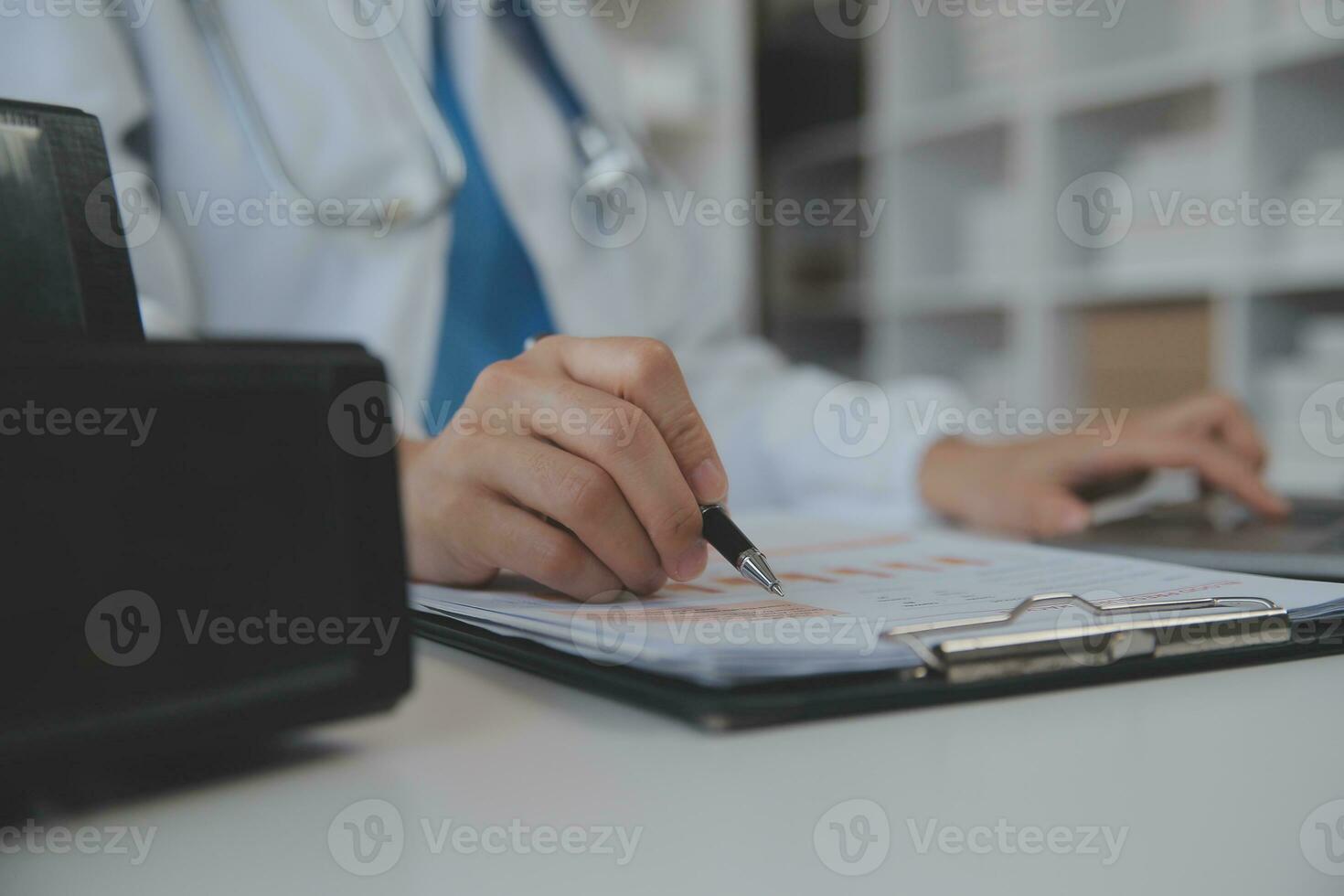 Professional lab. Amazing longhaired medical worker wearing uniform while using microscope during research photo