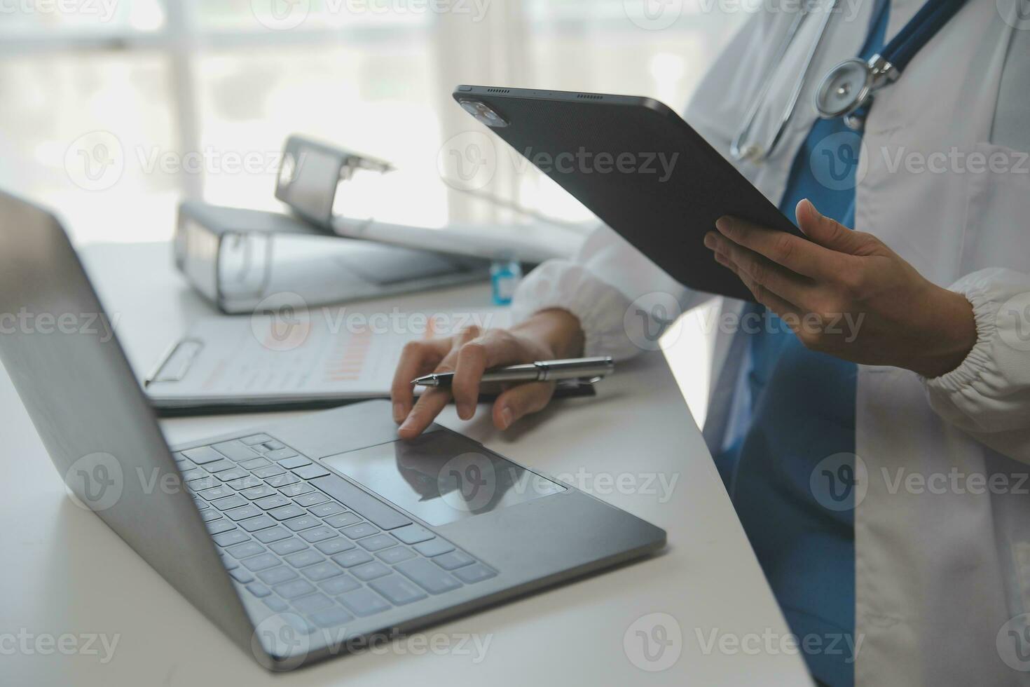 Professional lab. Amazing longhaired medical worker wearing uniform while using microscope during research photo