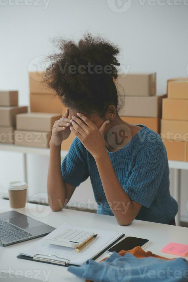 Business woman start up small business entrepreneur SME success .freelance woman working at home with Online Parcel delivery. SME and packaging deliveryconcept photo