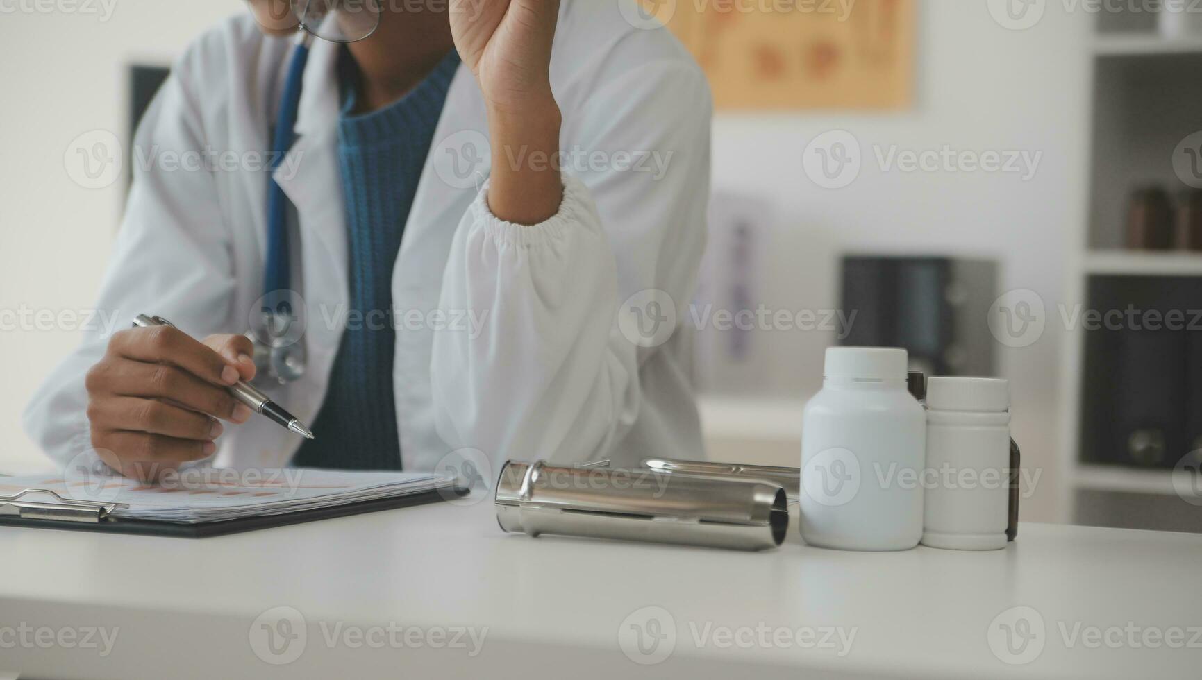 Professional lab. Amazing longhaired medical worker wearing uniform while using microscope during research photo