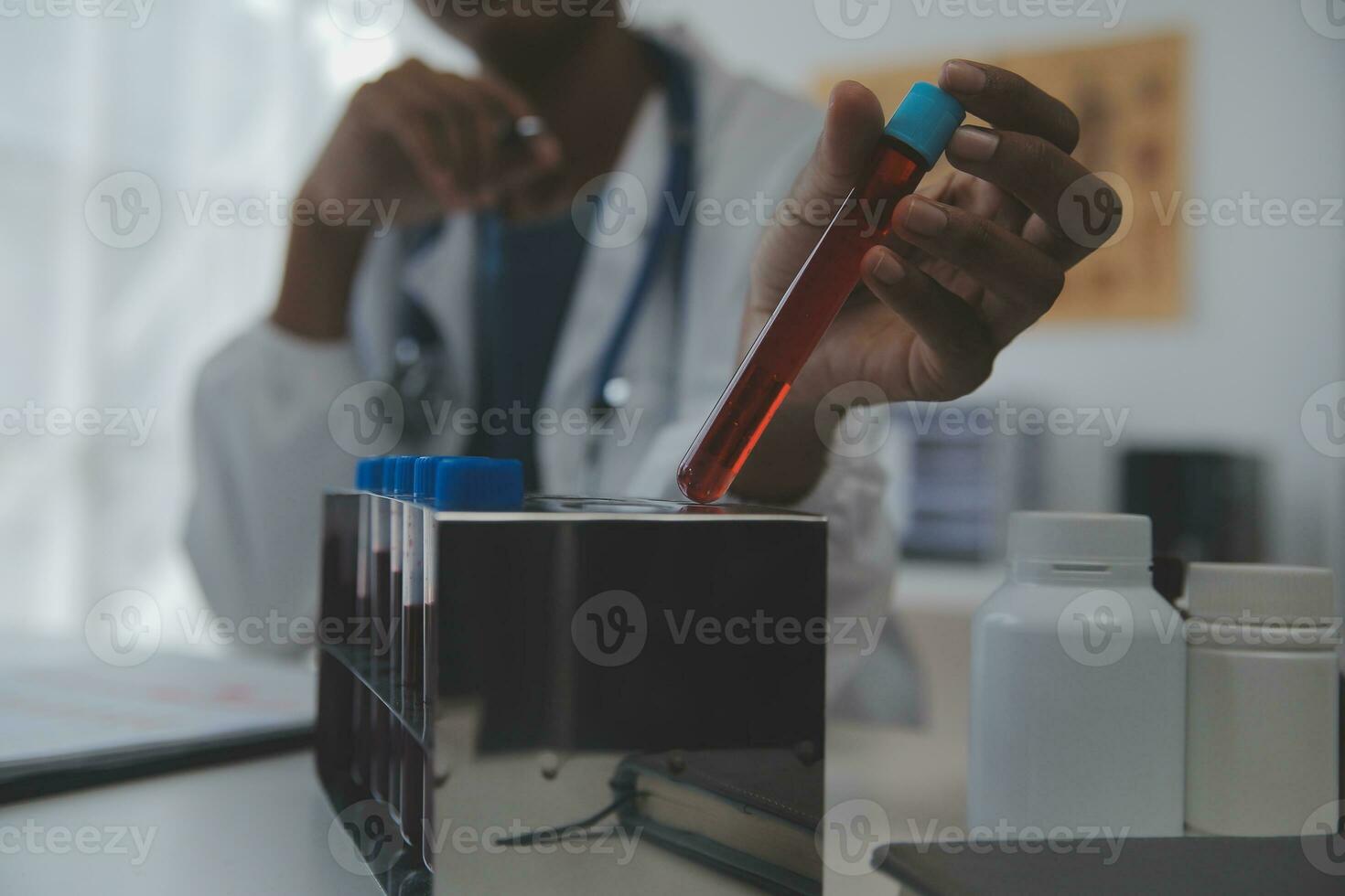 Professional lab. Amazing longhaired medical worker wearing uniform while using microscope during research photo