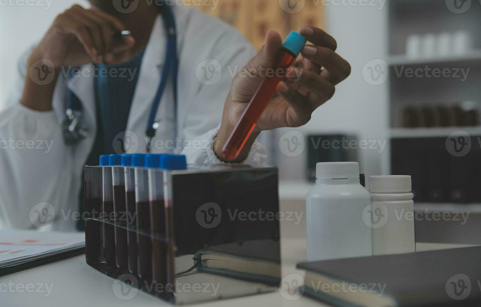 Professional lab. Amazing longhaired medical worker wearing uniform while using microscope during research photo