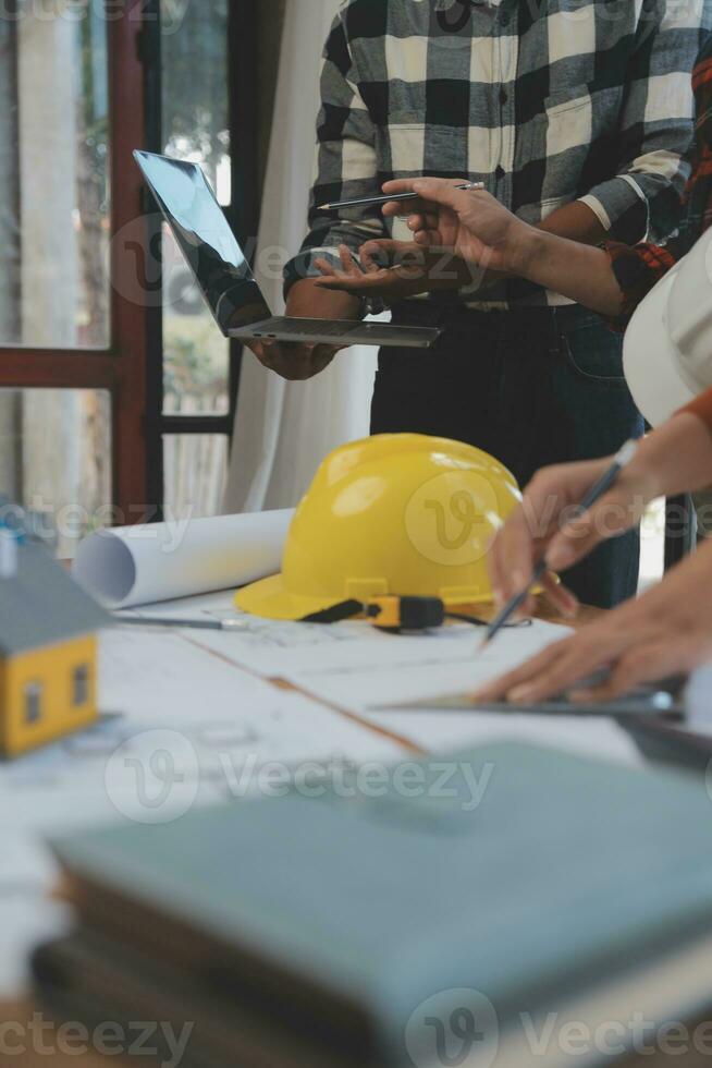 Engineer Teamwork Meeting, Drawing working on blueprint meeting for project working with partner on model building and engineering tools in working site, Construction and structure concept. photo